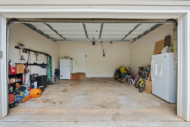5712 Cottontown Rd, Forest, VA 24551 - garage featuring freestanding refrigerator and a garage door opener