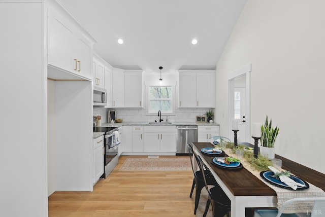 893 Cedar Gate Rd, Monroe, VA 24574 - kitchen with stainless steel appliances, a sink, decorative backsplash, white cabinets, and recessed lighting