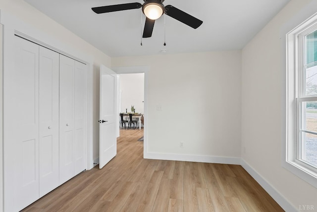 893 Cedar Gate Rd, Monroe, VA 24574 - unfurnished bedroom featuring light wood-type flooring, baseboards, a closet, and a ceiling fan