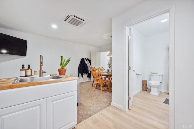 2236 Goode Station Rd, Goode, VA 24556 - bar featuring a sink, light wood finished floors, and recessed lighting