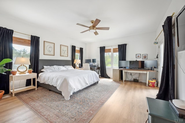 bedroom featuring a ceiling fan and light wood-type flooring