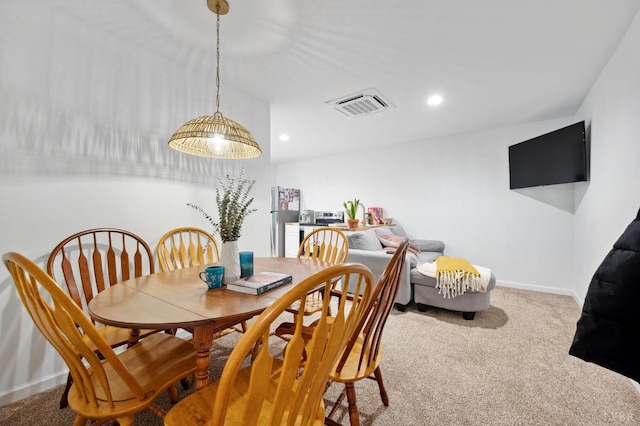 dining room featuring carpet floors, baseboards, visible vents, and recessed lighting