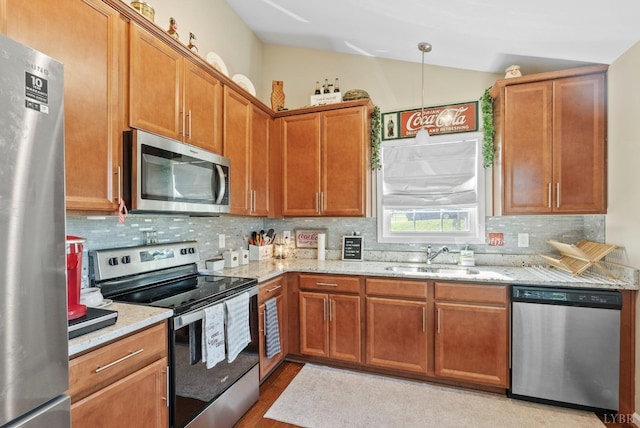 255 Traverse Dr, Evington, VA 24550 - kitchen with stainless steel appliances, a sink, backsplash, vaulted ceiling, and light stone countertops