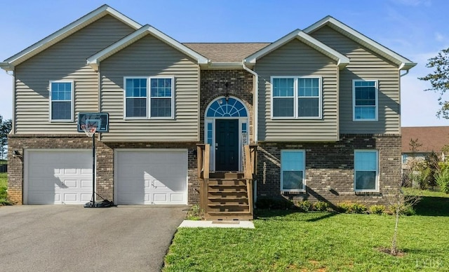 255 Traverse Dr, Evington, VA 24550 - view of front of house with brick siding, driveway, a front lawn, and an attached garage