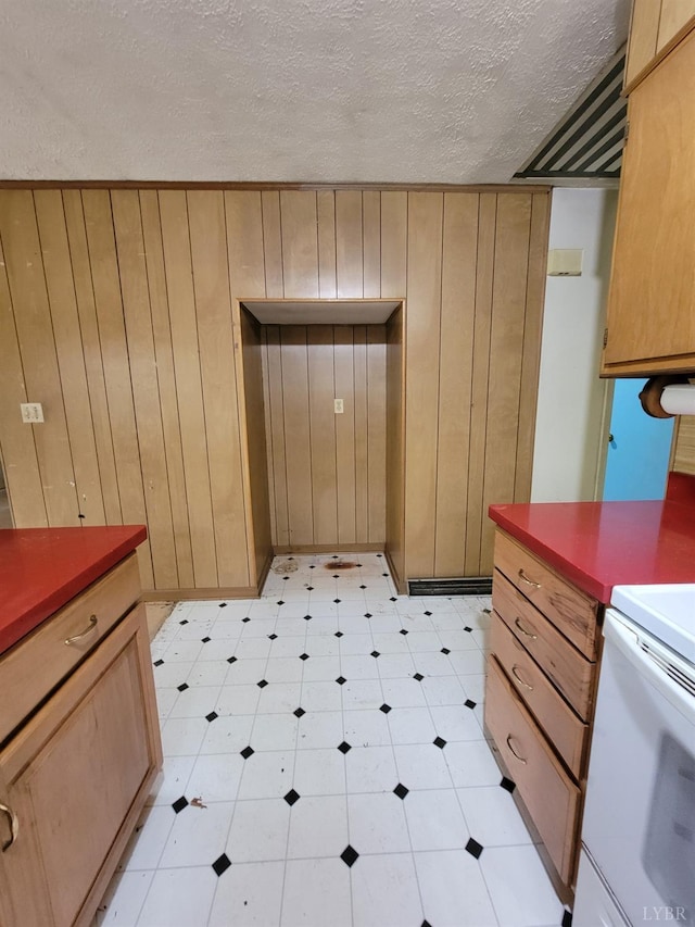 1418 Mitchell Rd, Chatham, VA 24531 - kitchen featuring light floors, wood walls, light brown cabinetry, and a textured ceiling