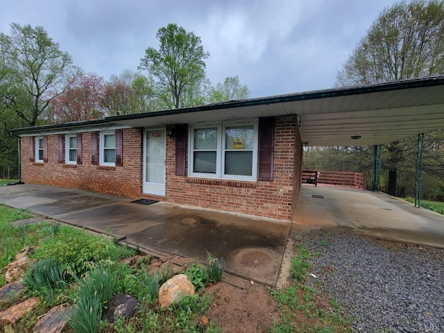 1418 Mitchell Rd, Chatham, VA 24531 - view of front of property featuring brick siding, a carport, and gravel driveway