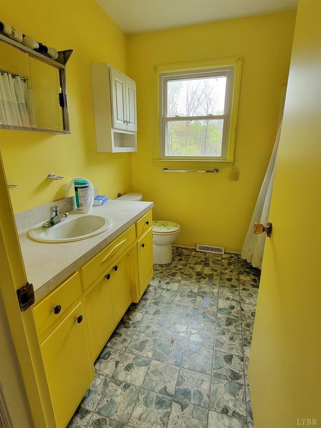 1418 Mitchell Rd, Chatham, VA 24531 - full bathroom with visible vents, vanity, stone finish floor, and toilet