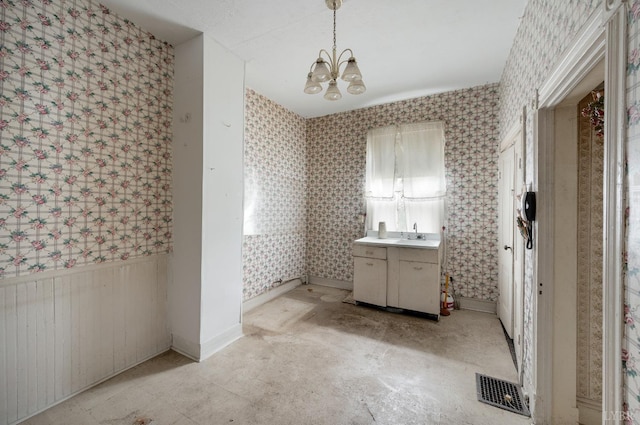 119 Harrison St, Lynchburg, VA 24504 - bathroom with visible vents, wallpapered walls, vanity, and a notable chandelier