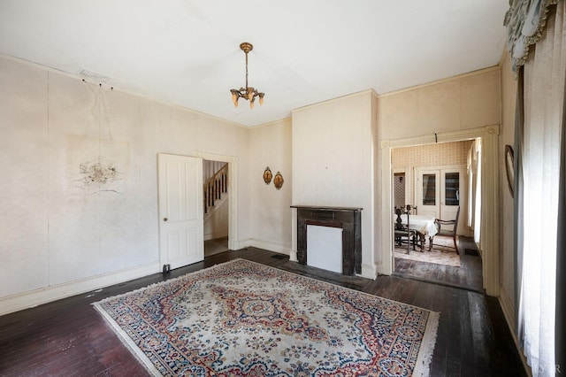 119 Harrison St, Lynchburg, VA 24504 - living room with a fireplace with flush hearth, a notable chandelier, stairway, and wood-type flooring