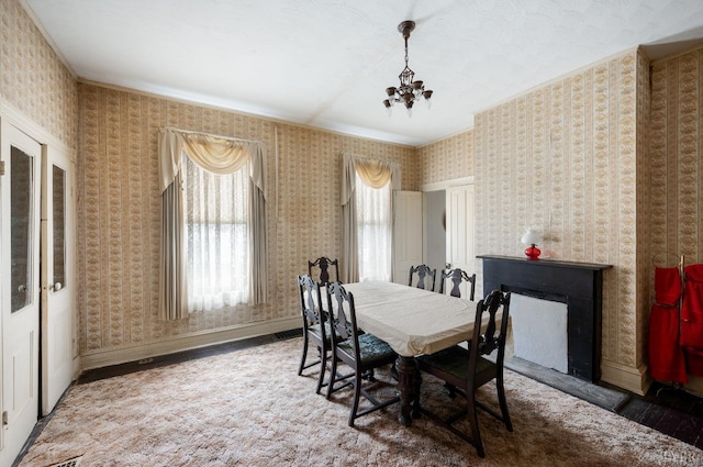 119 Harrison St, Lynchburg, VA 24504 - dining area featuring wallpapered walls, baseboards, an inviting chandelier, and crown molding