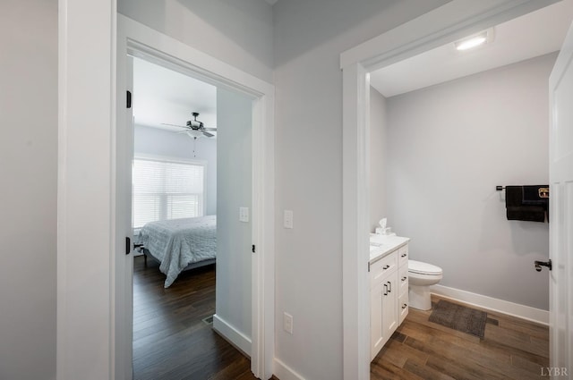 1033 Elk Creek Rd, Forest, VA 24551 - ensuite bathroom featuring wood finished floors, vanity, ceiling fan, and toilet