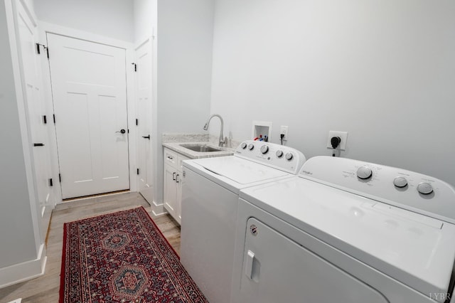 1033 Elk Creek Rd, Forest, VA 24551 - washroom featuring washing machine and dryer, light wood finished floors, cabinet space, and baseboards