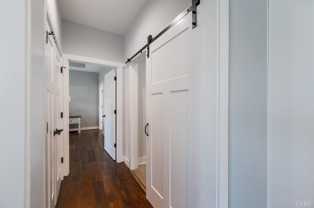 1033 Elk Creek Rd, Forest, VA 24551 - corridor featuring a barn door, dark wood-type flooring, and baseboards