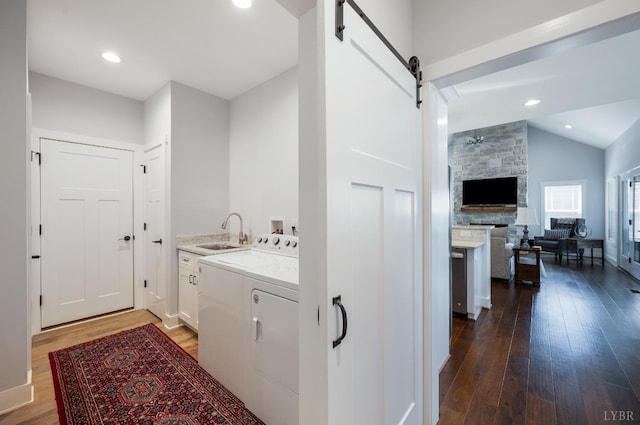 1033 Elk Creek Rd, Forest, VA 24551 - washroom featuring cabinet space, a barn door, separate washer and dryer, dark wood finished floors, and recessed lighting