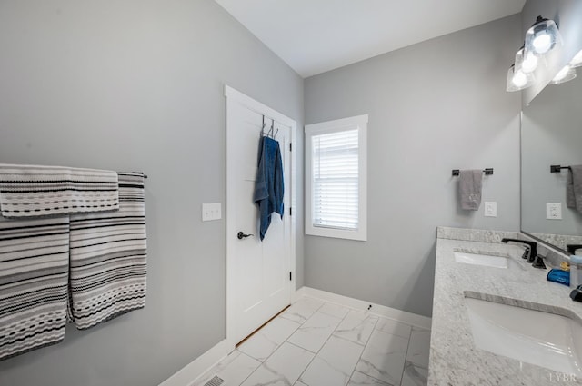 1033 Elk Creek Rd, Forest, VA 24551 - bathroom featuring marble look tiles, baseboards, and double vanity
