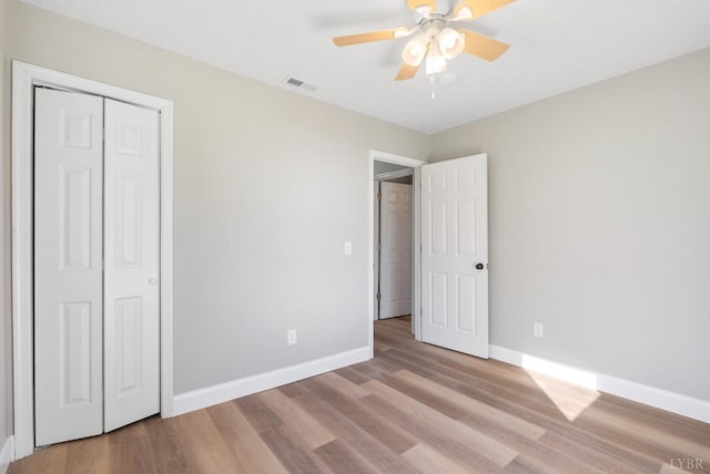 442 W King St, Bedford, VA 24523 - unfurnished bedroom featuring a closet, ceiling fan, light wood-style flooring, baseboards, and visible vents