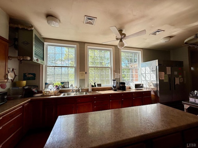 2134 Westerly Dr, Lynchburg, VA 24501 - kitchen with a sink, fridge, dark brown cabinets, visible vents, and a ceiling fan