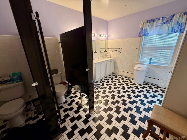 2134 Westerly Dr, Lynchburg, VA 24501 - full bathroom with a tile shower, tile walls, wainscoting, toilet, and vanity