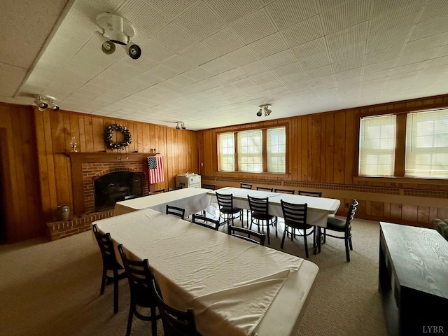 2134 Westerly Dr, Lynchburg, VA 24501 - dining area featuring a fireplace, carpet, and wood walls