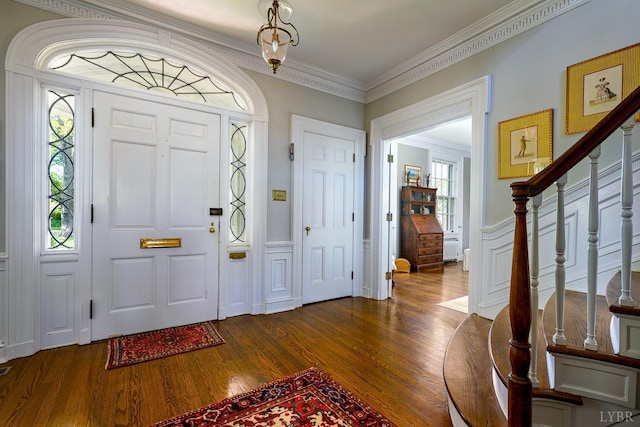 3830 Peakland Pl, Lynchburg, VA 24503 - foyer with a decorative wall, ornamental molding, dark wood finished floors, stairway, and wainscoting