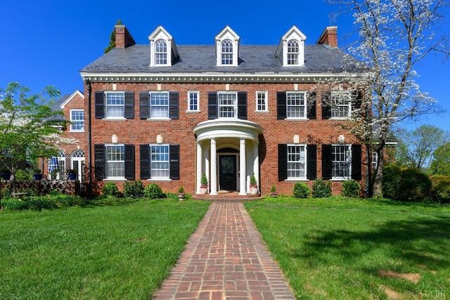 3830 Peakland Pl, Lynchburg, VA 24503 - georgian-style home with brick siding, a chimney, and a front yard