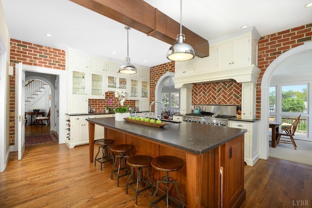 3830 Peakland Pl, Lynchburg, VA 24503 - kitchen featuring range, arched walkways, and dark countertops