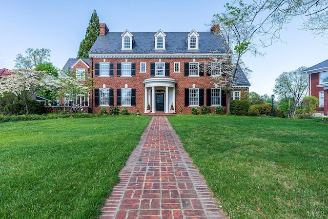 3830 Peakland Pl, Lynchburg, VA 24503 - georgian-style home featuring a chimney, a high end roof, brick siding, and a front yard
