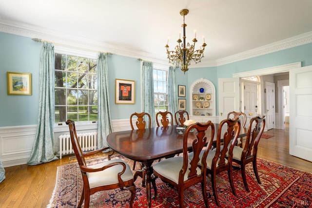 3830 Peakland Pl, Lynchburg, VA 24503 - dining room with wood finished floors, radiator, a notable chandelier, crown molding, and wainscoting