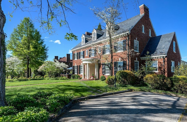 3830 Peakland Pl, Lynchburg, VA 24503 - colonial inspired home featuring a chimney, a high end roof, brick siding, and a front lawn