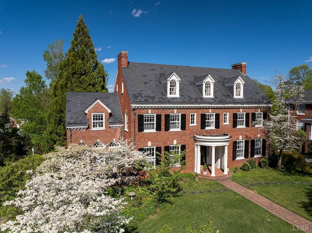 3830 Peakland Pl, Lynchburg, VA 24503 - colonial home featuring brick siding, a chimney, and a front yard