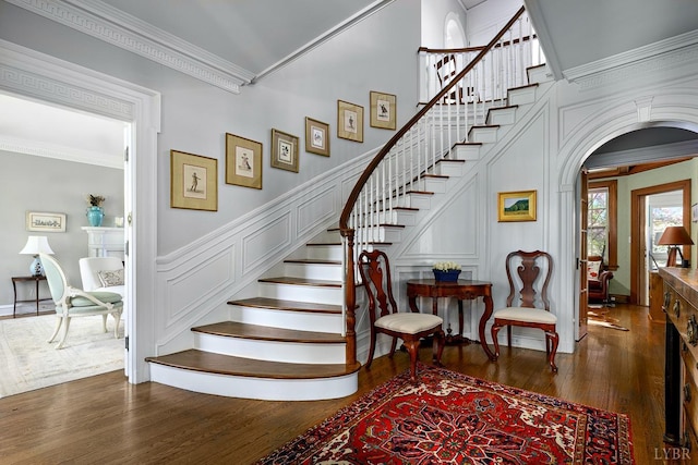 3830 Peakland Pl, Lynchburg, VA 24503 - staircase with a decorative wall, ornamental molding, arched walkways, and wood finished floors