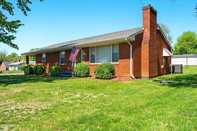 1321 Norfolk Ave, Bedford, VA 24523 - view of front of house featuring a chimney, central air condition unit, brick siding, and a front lawn