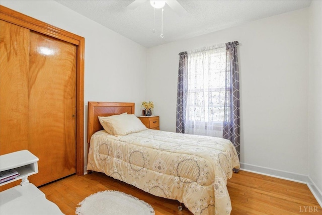 1321 Norfolk Ave, Bedford, VA 24523 - bedroom featuring wood finished floors, baseboards, a ceiling fan, a closet, and a textured ceiling