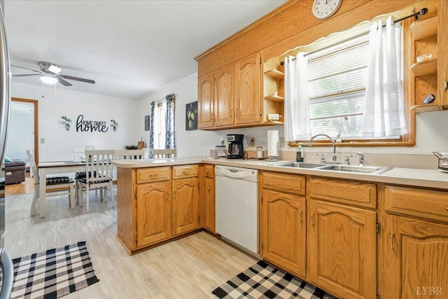 1321 Norfolk Ave, Bedford, VA 24523 - kitchen with white dishwasher, a sink, a peninsula, ceiling fan, and light countertops