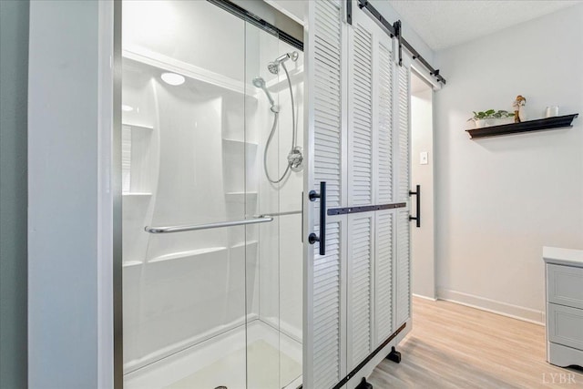 1321 Norfolk Ave, Bedford, VA 24523 - bathroom with a closet, a stall shower, and wood finished floors