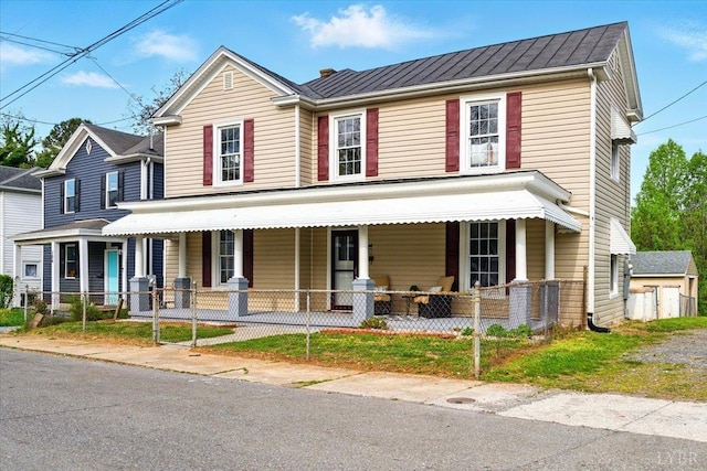 702 Dinwiddie St, Lynchburg, VA 24504 - view of front facade featuring covered porch and a fenced front yard