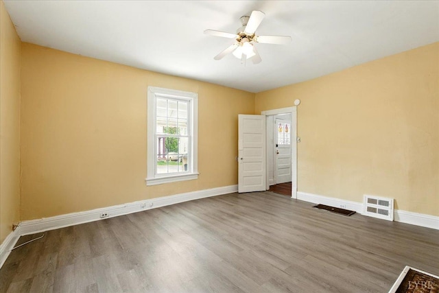 702 Dinwiddie St, Lynchburg, VA 24504 - empty room with wood finished floors, baseboards, and ceiling fan