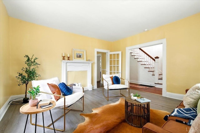 702 Dinwiddie St, Lynchburg, VA 24504 - living room with baseboards, stairs, and wood finished floors