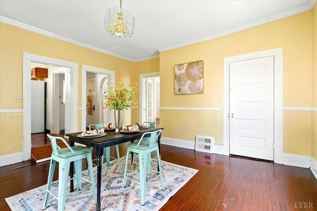 702 Dinwiddie St, Lynchburg, VA 24504 - dining room with a chandelier, wood-type flooring, ornamental molding, and baseboards