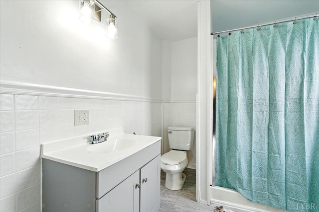 702 Dinwiddie St, Lynchburg, VA 24504 - bathroom with toilet, curtained shower, vanity, and tile walls