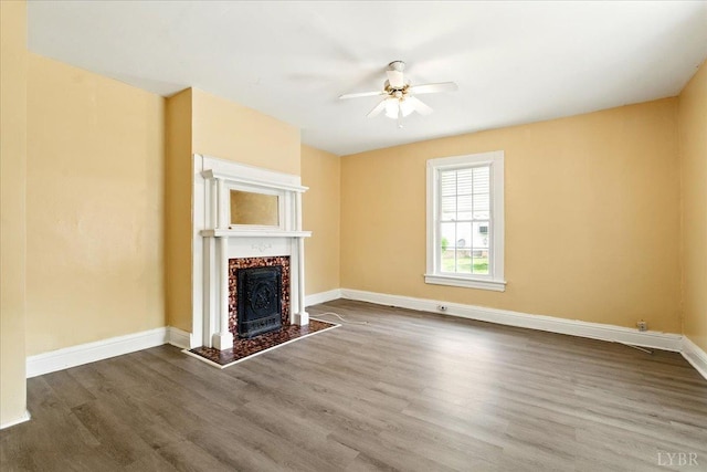 702 Dinwiddie St, Lynchburg, VA 24504 - unfurnished living room with a ceiling fan, wood finished floors, a high end fireplace, and baseboards