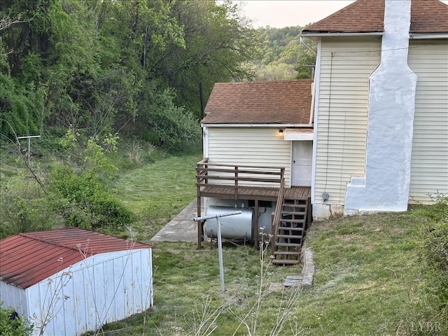 207 Winston Ridge Rd, Lynchburg, VA 24501 - exterior space featuring a wooden deck, heating fuel, a shingled roof, stairway, and a yard