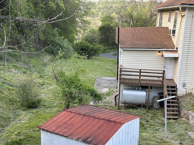 207 Winston Ridge Rd, Lynchburg, VA 24501 - view of yard featuring a wooden deck, a view of trees, heating fuel, and stairs