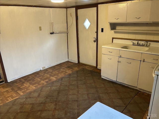 207 Winston Ridge Rd, Lynchburg, VA 24501 - kitchen with baseboards, dark floors, a sink, and light countertops
