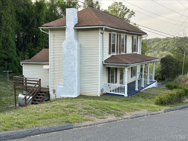 207 Winston Ridge Rd, Lynchburg, VA 24501 - exterior space featuring a front lawn, roof with shingles, a chimney, and covered porch