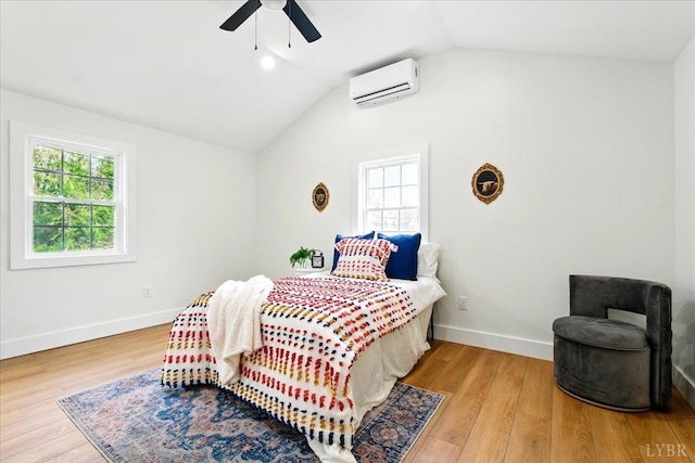 17 Beverly St, Lynchburg, VA 24501 - bedroom featuring an AC wall unit, multiple windows, wood finished floors, vaulted ceiling, and ceiling fan