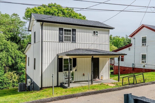 17 Beverly St, Lynchburg, VA 24501 - view of front facade featuring roof with shingles, a front lawn, and cooling unit