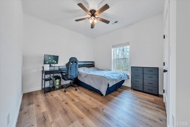 9900 Stonewall Rd, Appomattox, VA 24522 - bedroom with baseboards, a ceiling fan, wood finished floors, and visible vents