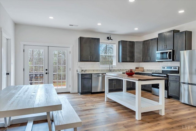 9900 Stonewall Rd, Appomattox, VA 24522 - kitchen with backsplash, recessed lighting, appliances with stainless steel finishes, and light countertops