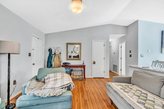 3783 Praline Pl, Roanoke, VA 24012 - living area featuring light wood finished floors, lofted ceiling, and baseboards